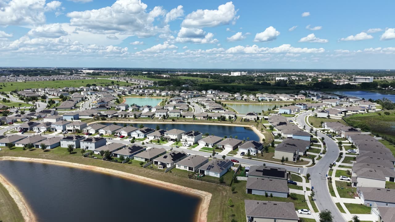 Aerial view of the Charles Cove community lake and waterfront homes