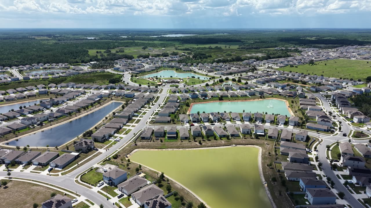 Aerial view of Charles Cove streets, homes and ponds